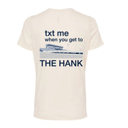 Beige t-shirt with text and graphic design on a white background